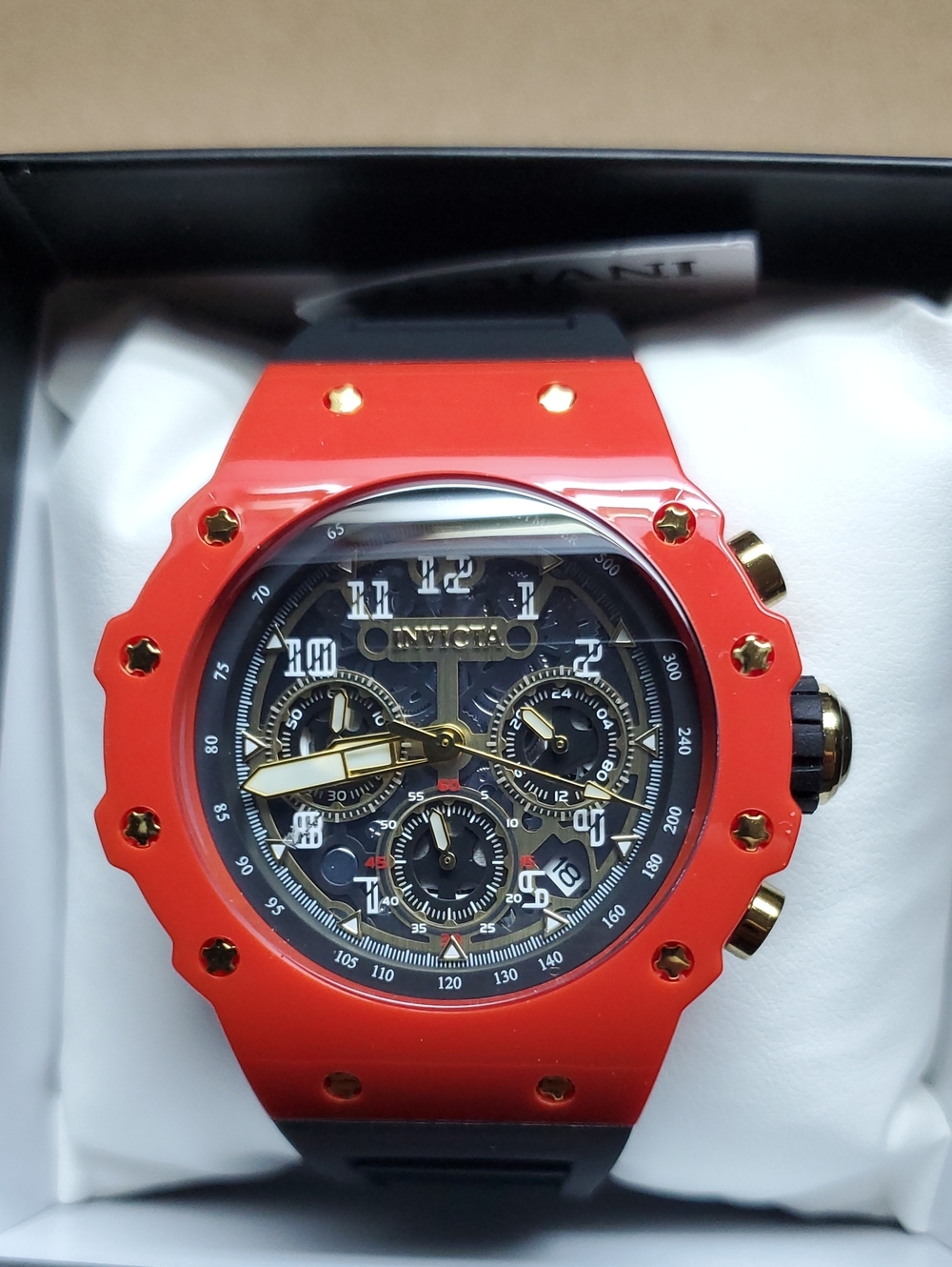 Invicta Red and Black Chronograph Watch with Gold Accents